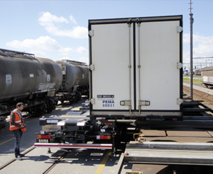 Man is changing truckload to another trailer with the HBC radio control